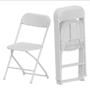 A white folding chair with no back and no arms.