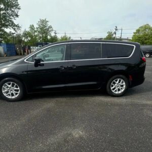 A black van is parked in the parking lot.